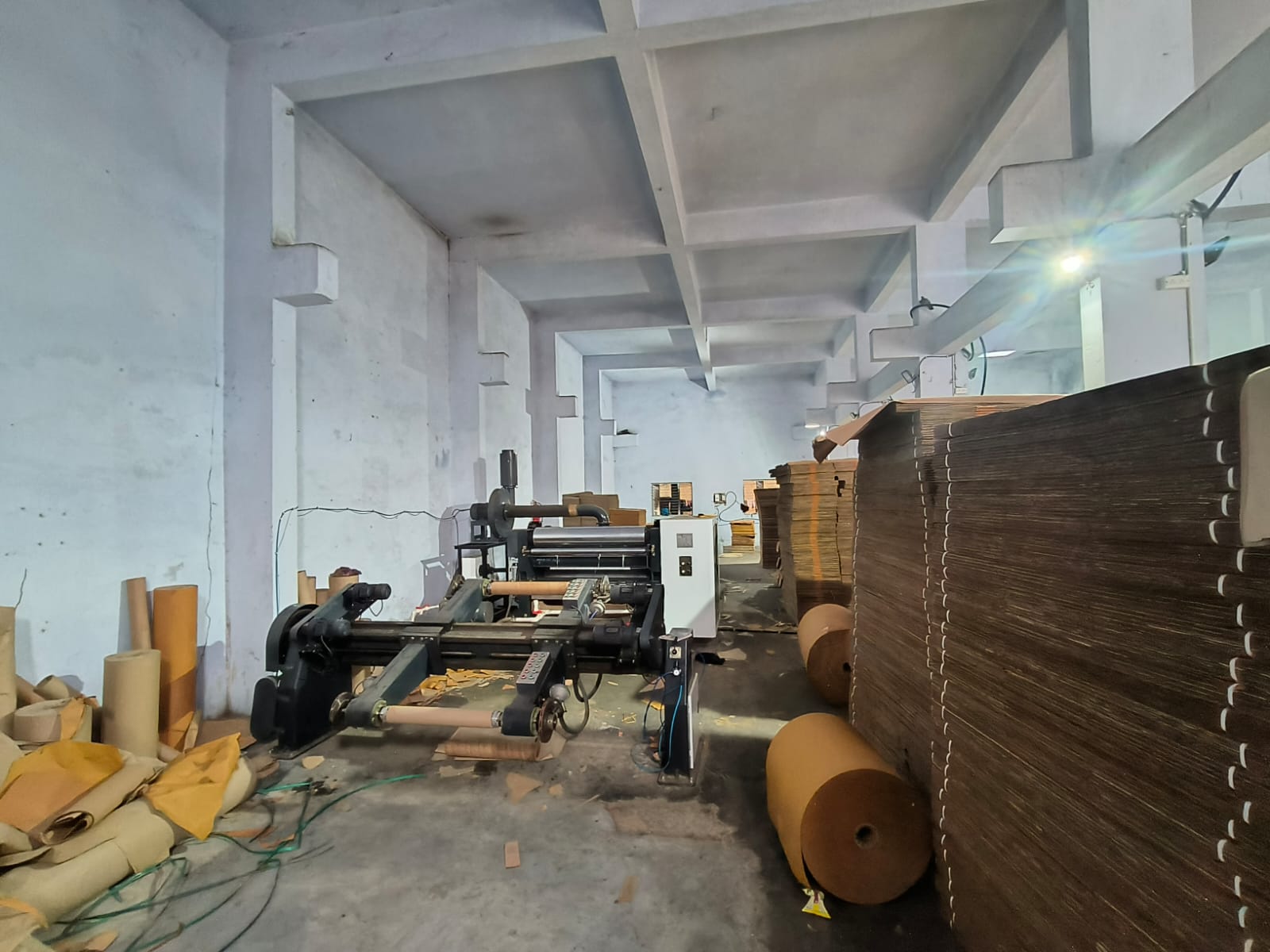 Corrugation line with kraft paper rolls at Maa Ashapura Print & Pack, Ahmedabad